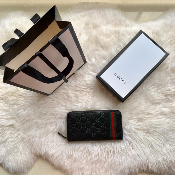 G*u*i leather zip around wallet
