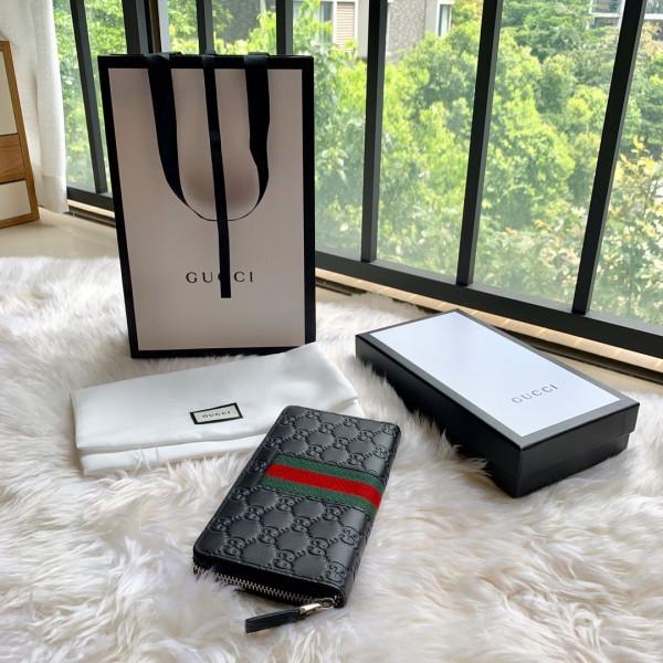 G*u*i leather zip around wallet
