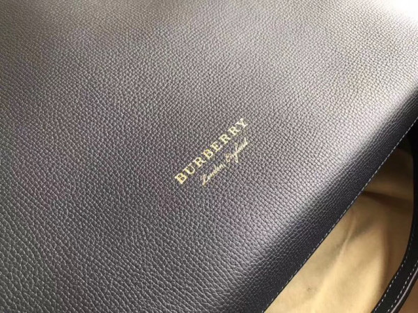 B**rry the medium banner in leather and house check